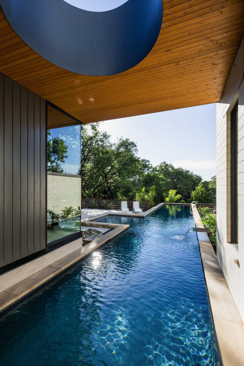 A Modern Home In Austin With A Pool That Bisects The House
