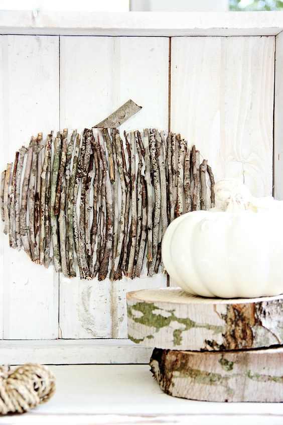 a twig pumpkin on a board is an easy rustic-inspired fall decoration you can make yourself