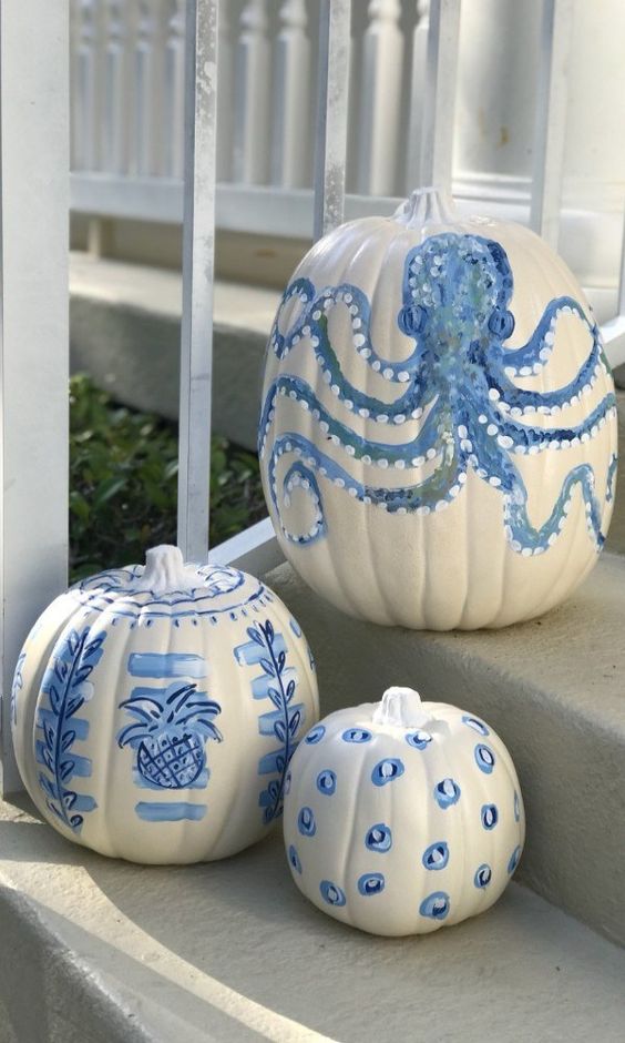 coastal pumpkins in white and blues - with various painted motifs - are great for fall coastal decor, outdoors and indoors