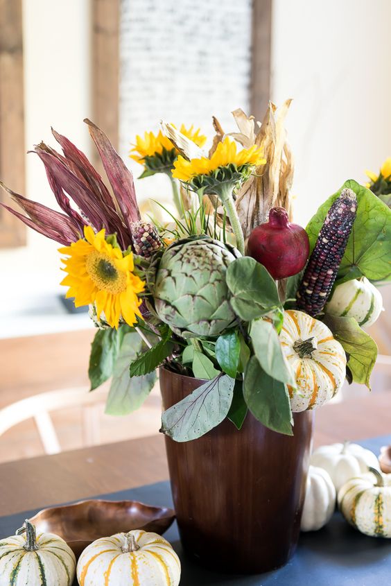 A Farmhouse Centerpiece Of Faux Blooms, Husks, Veggies And Some Foliage Is A Cool Fall Decor Idea