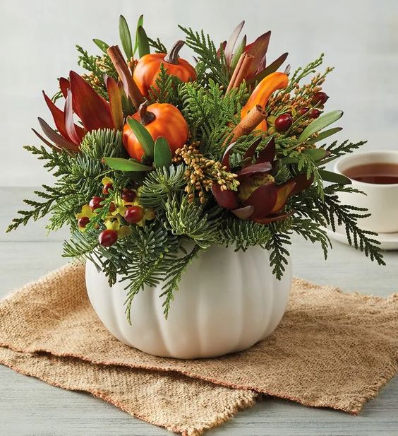 A White Pumpkin With Faux Blooms, Berries, Greenery And Faxu Pumpkins And Gourds For The Fall