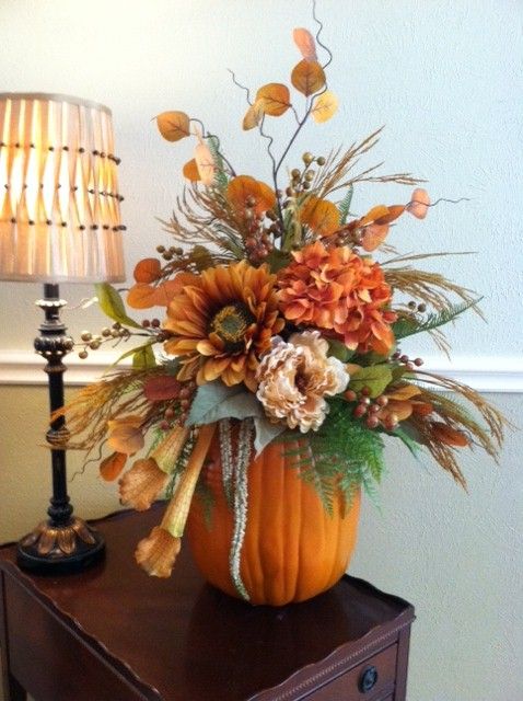 A Pumpkin With Greenery, Bright Faux Blooms, Twigs, Branches Is A Stylish Fall Centerpiece Or Decoration