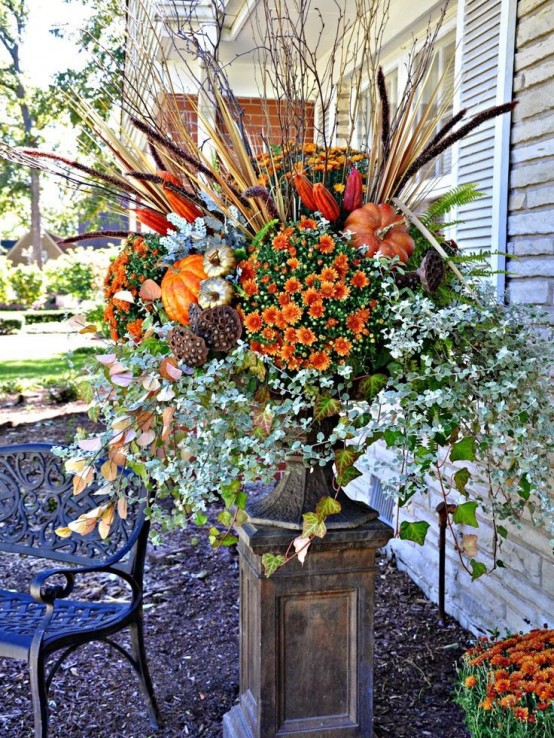 A Bold And Lush Fall Arrangement Of A Vintage Urn With Faux Blooming Branches, Lotus, Dried Leaves, Twigs, Faux Pumpkins And Lots Of Other Stuff For Outdoors