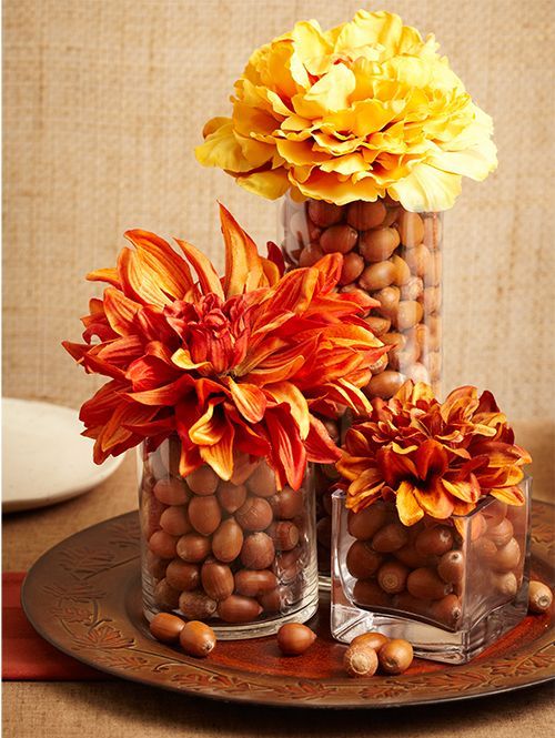 A Fall Centerpiece Of A Tray With Glasses With Nuts Topped With Large Bright Fall Blooms Is A Stylish Centerpiece To Rock