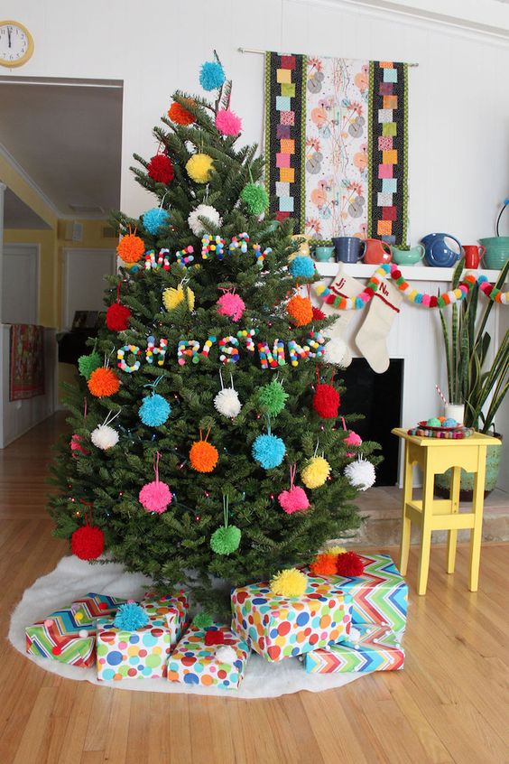 A Christmas Tree With Colorful Pompom Ornaments And Colorful Pompom Letters Is Very Awesome