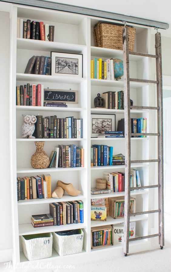 A Custom Ikea Bookshelf Built-In, With A Ladder And Some Basket For Storage Is A Veyr Nice Option To Rock