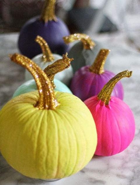 An Arrangement Of Colorful Pumpkins With Glitter Stems For An Ultimate Glam Halloween Party