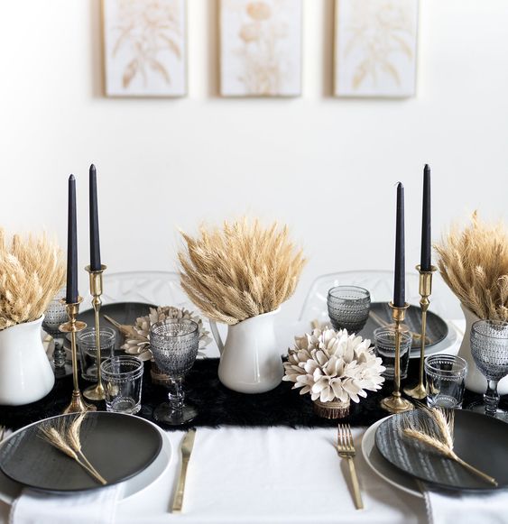 A Bold Thanksgiving Tablescape With A Black Runner And Plates, Black Candles, Wheat In Jugs Is Very Elegant