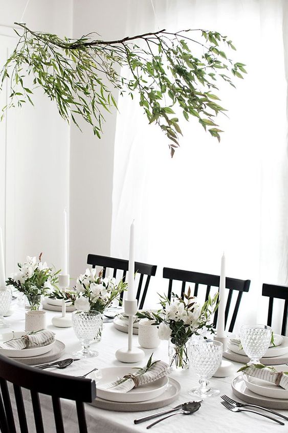 A Modern And Very Neutral Thanksgiving Tablescape With Neutral Porcelain And Linens, Greenery And White Blooms Plus White Candles