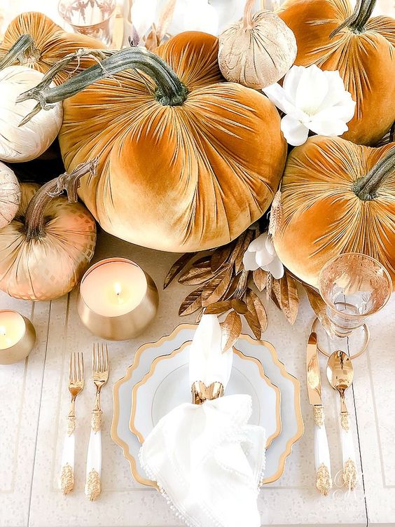 Oddly Shaped Gold Rimmer Plates, Gold And White Cutlery, Gold Candleholders And Glasses Plus Rust Pumpkins For A Wow Thanksgiving Table
