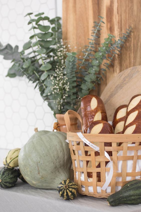 Green Pumpkins And Gourds, Eucalyptus In A Vase And A Basket With Faux Bread For Cool Rustic Thanksgiving Decor