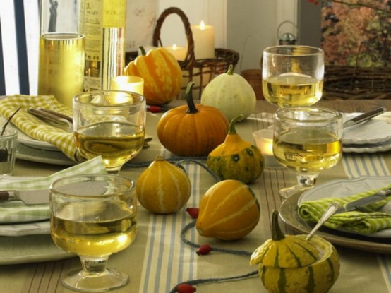 All-Natural Pumpkins And Gourds Echo With Plates And Glasses And Give A Cozy Natural Look To The Tablescape