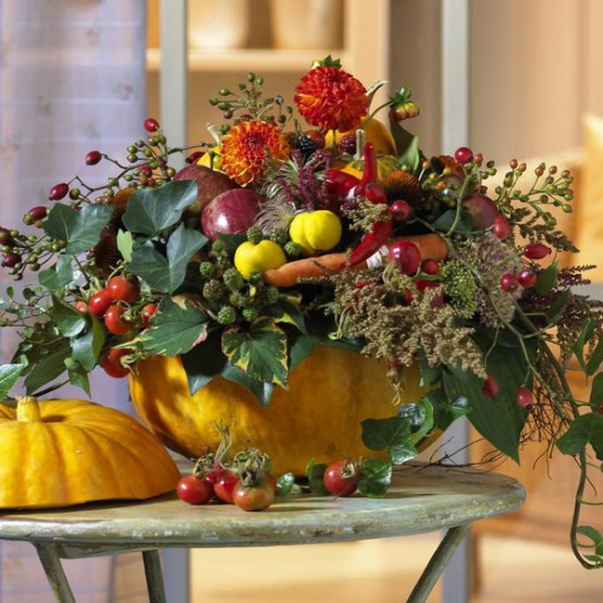 A Pumpkin With Lots Of Greenery, Bright Bold Blooms And Veggies Will Be A Nice And Chic Thanksgiving Centerpiece