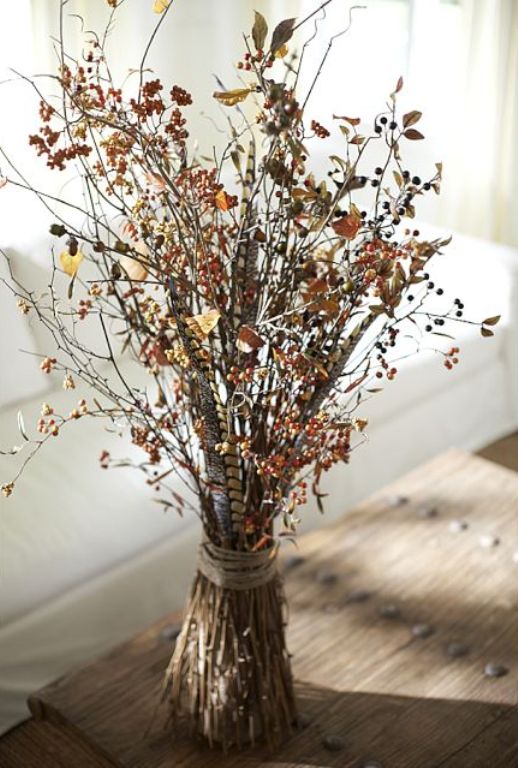 An Arrangement Of Dried Leaves And Berries Is A Pretty Idea For Fall Or Thanksgiving Decor