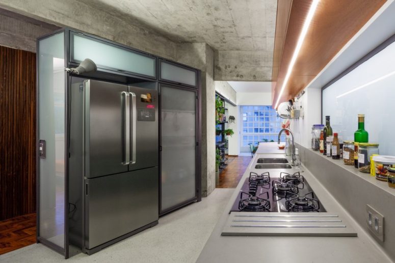 The Kitchen Has An Asymmetrical Layout, With One Of The Wall Placed At An Angle