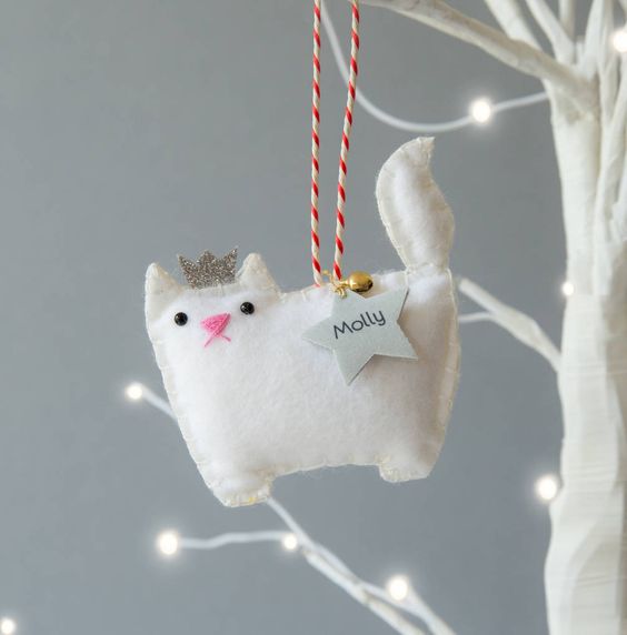 A White Princess Cat Ornament Of Felt, With A Bell And A Star Is A Gorgeous Personalize Idea For Christmas