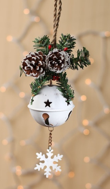A White Star Cut Bell With A Snowflake, Fir Branches, Berries And Snowy Pinecones Is A Very Chic Ornament Or Just A Decoration For Your Door