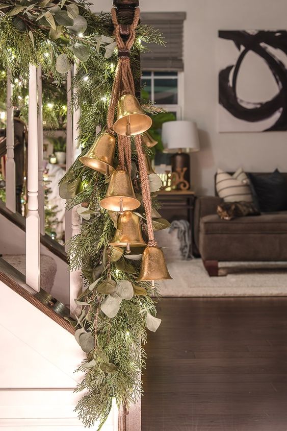 Decorate The Railing With Foliage, Fir Branches, Lights And Vintage Bells To Make Your Space Look Very Holiday-Like